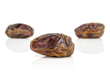 Dry brown date fruit isolated on white