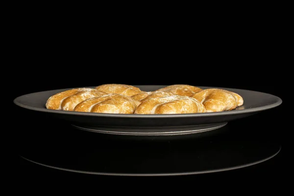 Sweet brown gingerbread isolated on black glass — Stock Photo, Image