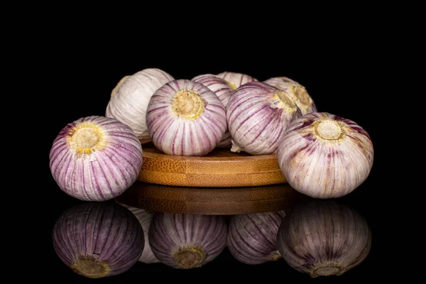 Single clove garlic isolated on black glass — Stockfoto