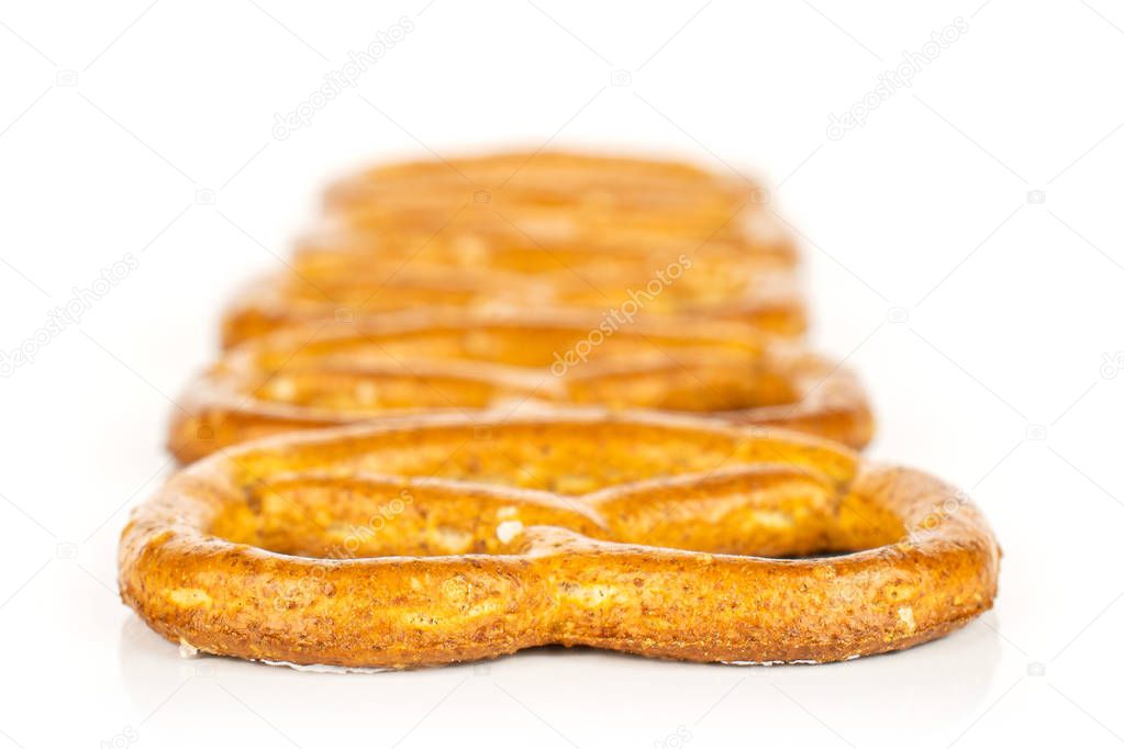 Salty brown pretzel isolated on white