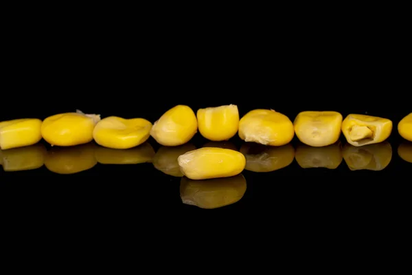 Lot Pieces Sweet Canned Yellow Corn Isolated Black Glass — Stock Photo, Image