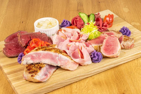 Beautiful meat board on lacquered wood