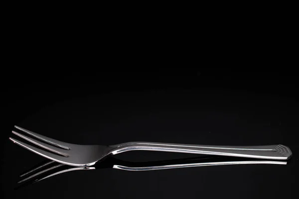 One Whole Steel Silver Fork Isolated Black Glass — Stock Photo, Image