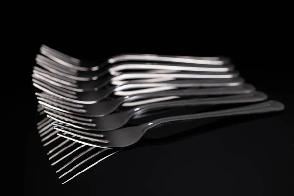 Lot Whole Steel Silver Fork Isolated Black Glass — Stock Photo, Image