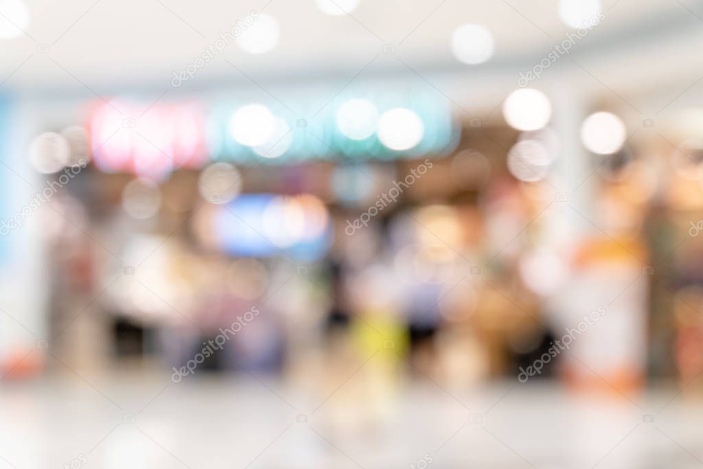 Abstract blur lighting bokeh shopping mall interior of department store for background and backdrop.