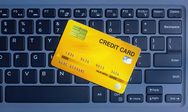 Credit card on modern keyboard Concept of On-line shopping on the internet using a laptop and bill payment