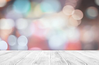 Empty white wooden table top on blurred bokeh background. Used for display or montage your products.
