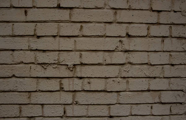 Beżowa Ceglana Ściana Kapslami — Zdjęcie stockowe