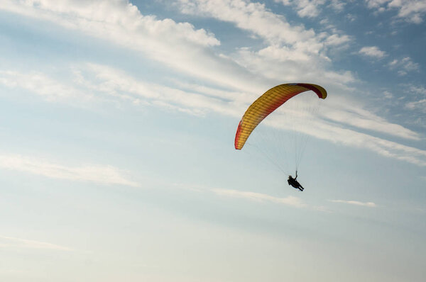 person flying on paraplane