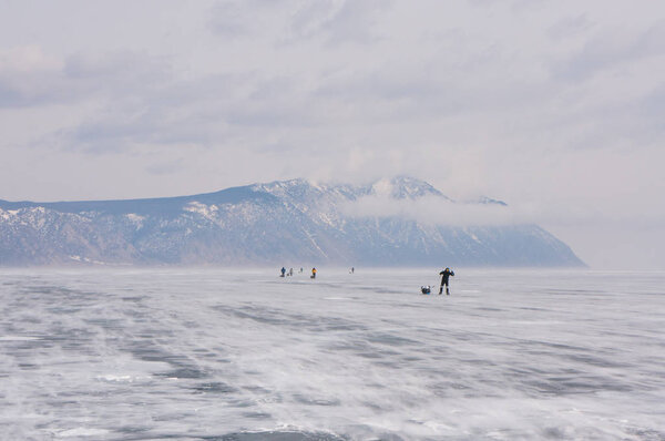 people on frozen river