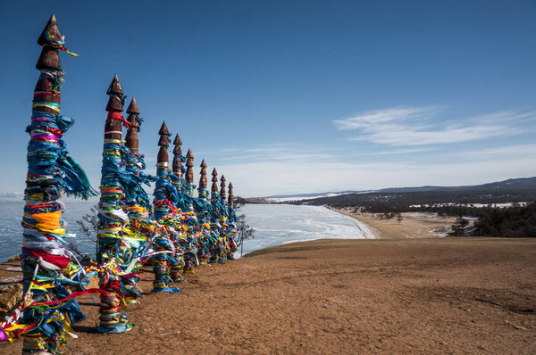 wooden pillars with colorful ribbons