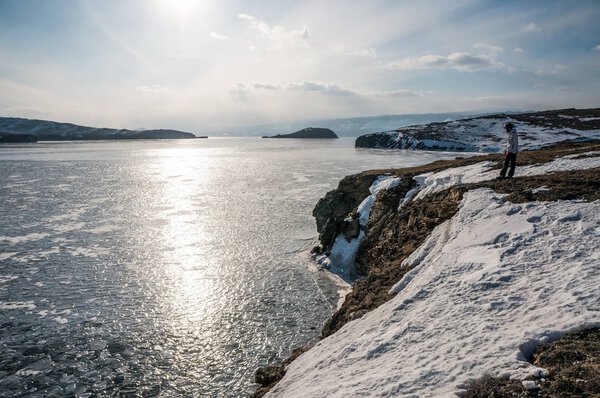 woman standing on snowy mountain