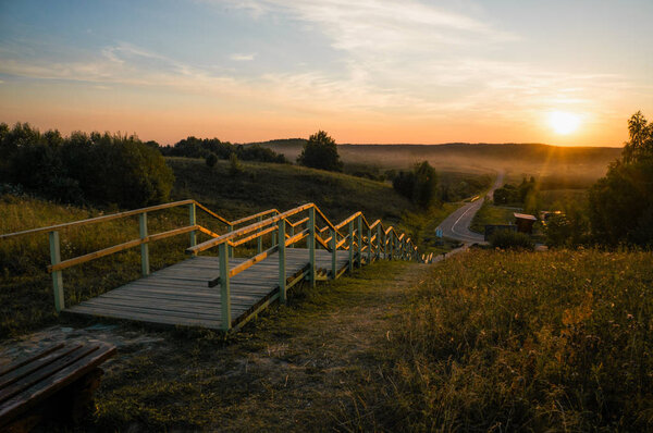 wooden stairs at sunset