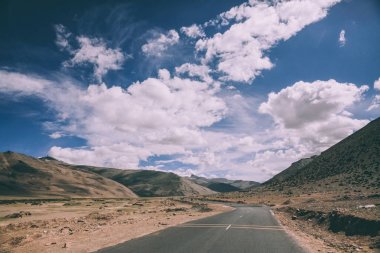 empty asphalt mountain road in Indian Himalayas, Ladakh region  clipart