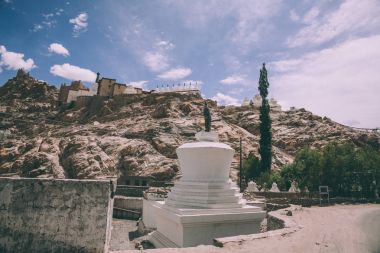 traditional white stupa in Leh, Indian Himalayas clipart