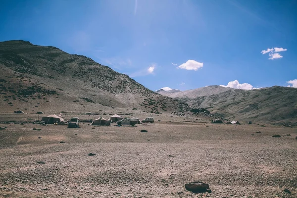 mountain camp with cars and tents in Indian Himalayas, Ladakh region