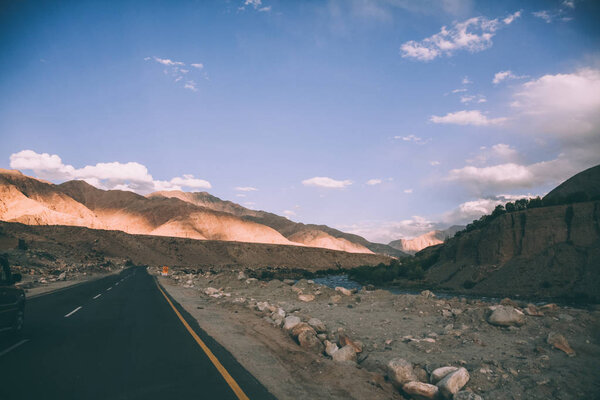 asphalt road and majestic rocky mountains in Indian Himalayas, Ladakh region