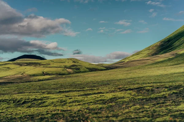 beautiful scenic landscape with green hills in Iceland  
