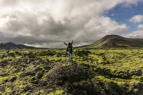 Person Standing Rock Raised Hands Looking Scenic Icelandic Landscape — Stock Photo, Image