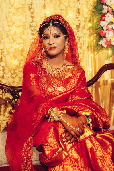 portrait of beautiful indian woman in traditional clothes looking at camera