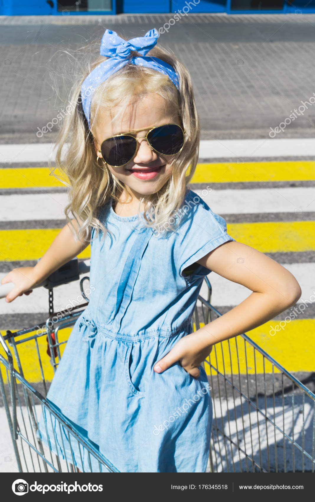 Little Adorable Female Kid Sunglasses Having Fun Shopping Cart Crosswalk Stock Photo YuliyaKirayonakBO 176345518