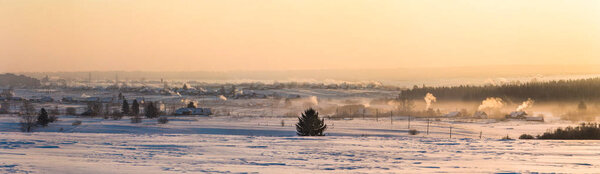 beautiful winter landscape and village at countryside at sunset, kazan region, russia