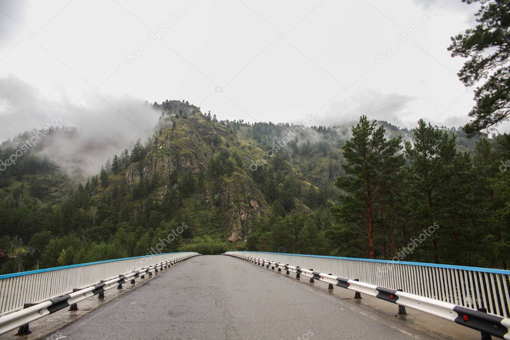 beautiful mountain landscape and asphalt road at cloudy day, Altai, Russia