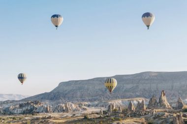 mountain landscape with Hot air balloons in Goreme national park, fairy chimneys, Cappadocia, Turkey clipart