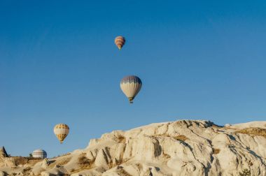 Hot air balloons festival in Goreme national park, fairy chimneys, Cappadocia, Turkey clipart