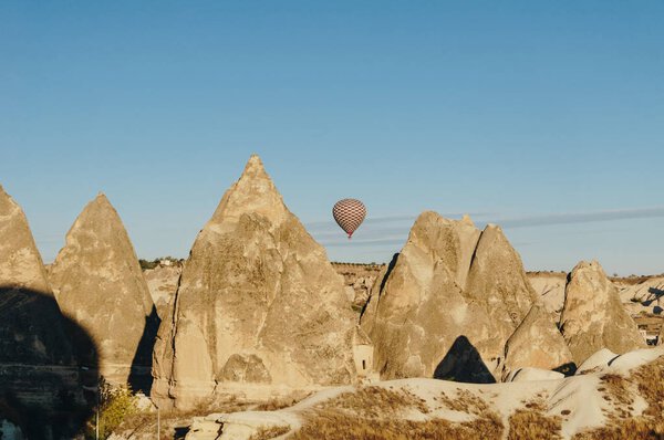 Hot air balloon flying in Goreme national park, fairy chimneys, Cappadocia, Turkey