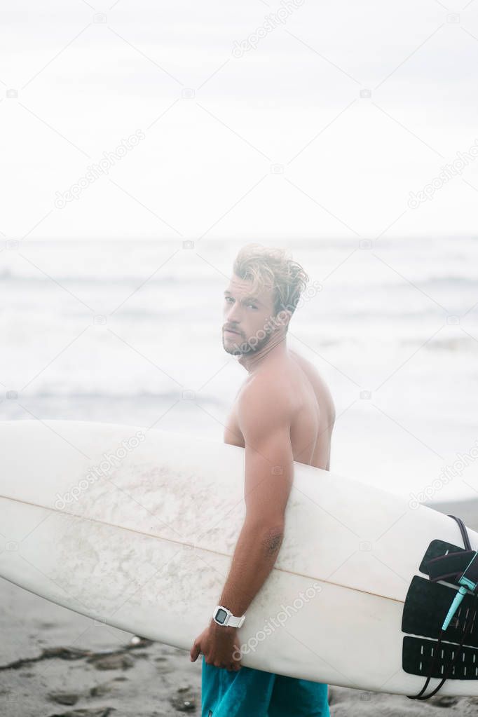 Handsome surfer