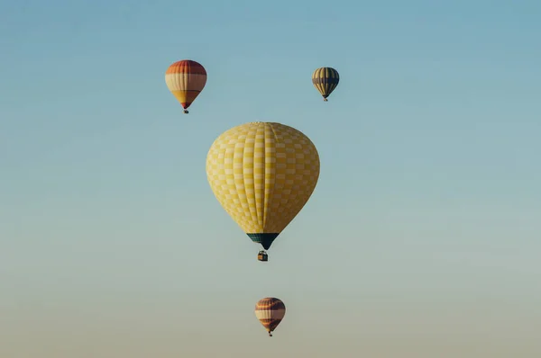 Hot air balloons flying in blue sky — Stock Photo