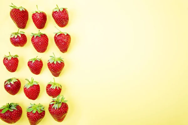 Strawberries on a yellow background — Stock Photo, Image