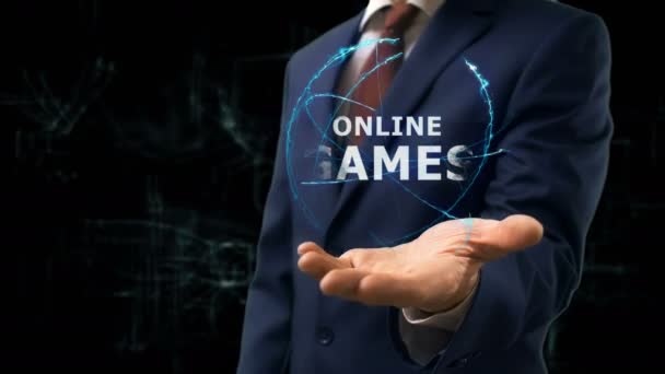 Uomo d'affari mostra concetto ologramma Giochi online sulla sua mano — Video Stock