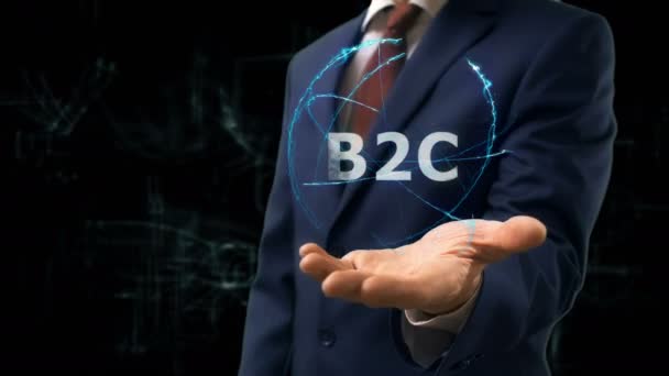 Geschäftsmann zeigt Konzept-Hologramm b2c auf seiner Hand — Stockvideo