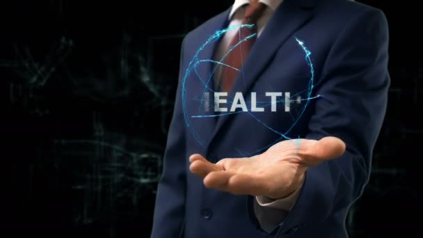 Empresario muestra concepto holograma Salud en su mano — Vídeos de Stock