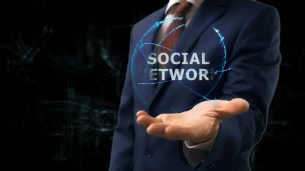 Επιχειρηματίας ολόγραμμα έννοια κοινωνικού δικτύου δείχνει στο χέρι του — Αρχείο Βίντεο