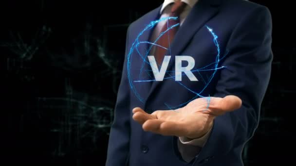 Empresario muestra concepto holograma VR en su mano — Vídeo de stock