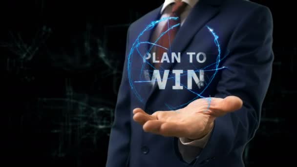 Empresário mostra conceito holograma Plano para ganhar em sua mão — Vídeo de Stock