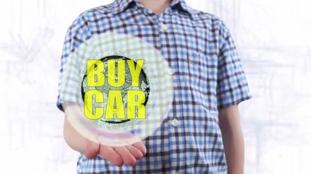Молодой человек показывает голограмму планеты Земля и текст Купить автомобиль — стоковое видео