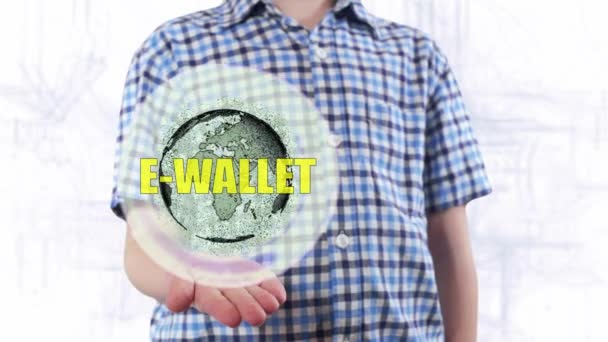젊은 남자는 지구 행성의 홀로그램 텍스트 전자 지갑 보여줍니다. — 비디오