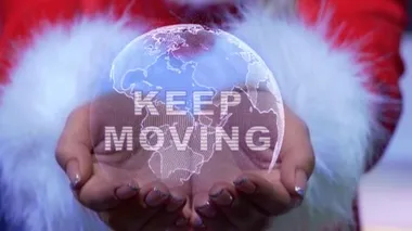 Hands holding planet with text Keep moving