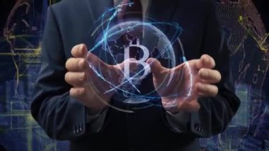 Male hands activate hologram Sign BTC