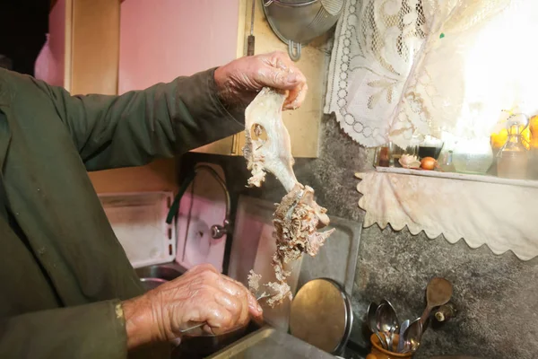 Man removing pork meat from bone — Stock Photo, Image