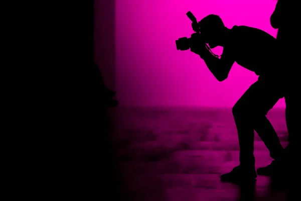 Silhouette of a photographer — Stock Photo, Image