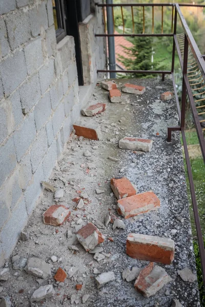 Scattered and damaged bricks on the balcony of the house after a strong earthquake of 5.5 on the Richter scale one month ago in Zagreb, Croatia