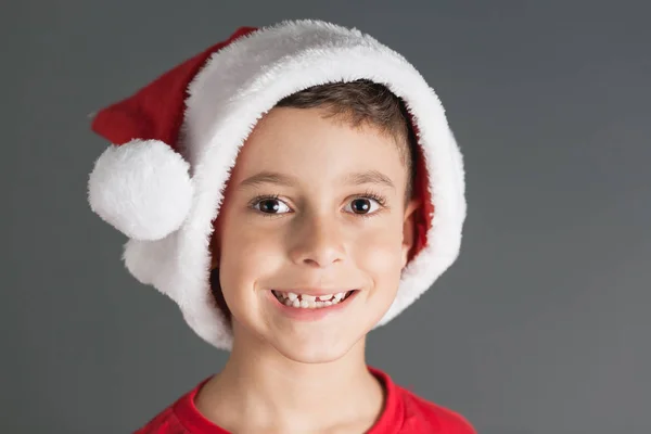 Portrait of beautiful boy wearing Santa Claus hat Stock Image