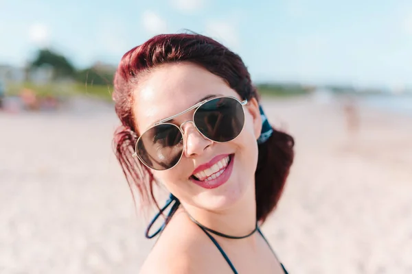 Close up portrait of young redhead woman on the beach — Stock Photo, Image