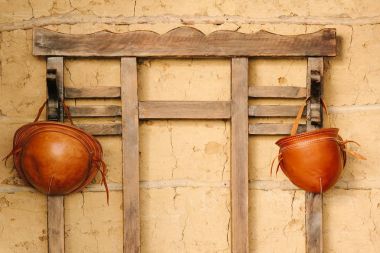 Traditional leather hats from northeastern Brazil hanging in hat rack clipart