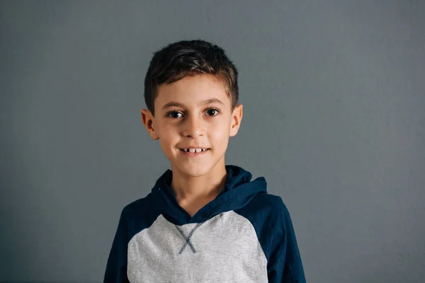 Portrait of Brazilian boy on gray background — Stock Photo, Image